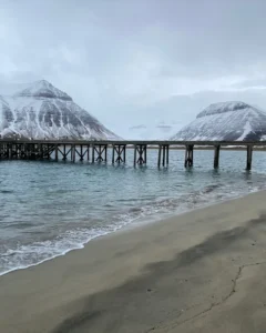 view of pier going over the icy waters at the westfjords during iceland elopement