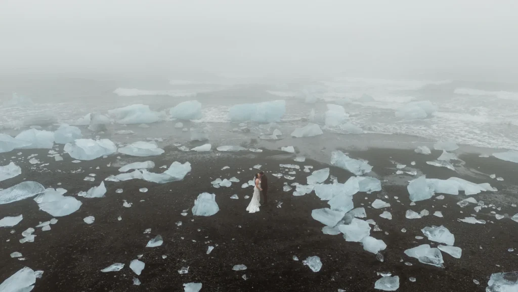 bride and groom at one of icelands best places to elope, diamond beach