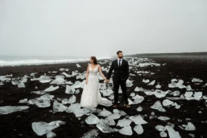bride and groom pose for wedding photographer at best place to elope in iceland