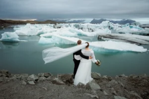 bride and groom look out at glaciers at iceland best places to elope, Jökulsárlón