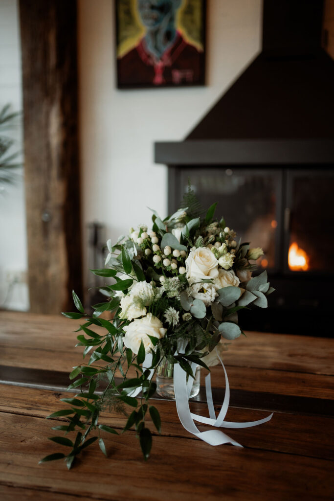 elopement bouquet sits in vase on table