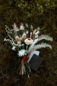 elopement bouquet sits on the ground during iceland wedding