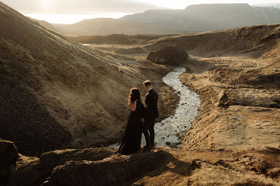 Husband and Wife overlook Helgufoss Valley in Iceland during sunset elopement with Iceland Wedding Photographer, Lia Photo Stories.