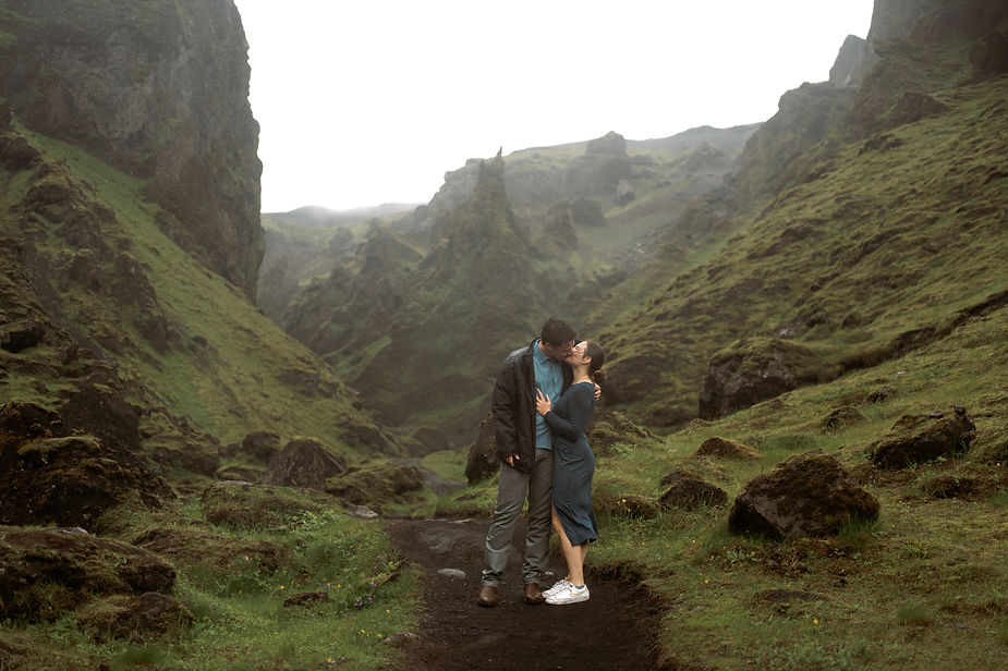 engaged couple poses for iceland elopement photographer during surprise proposal.