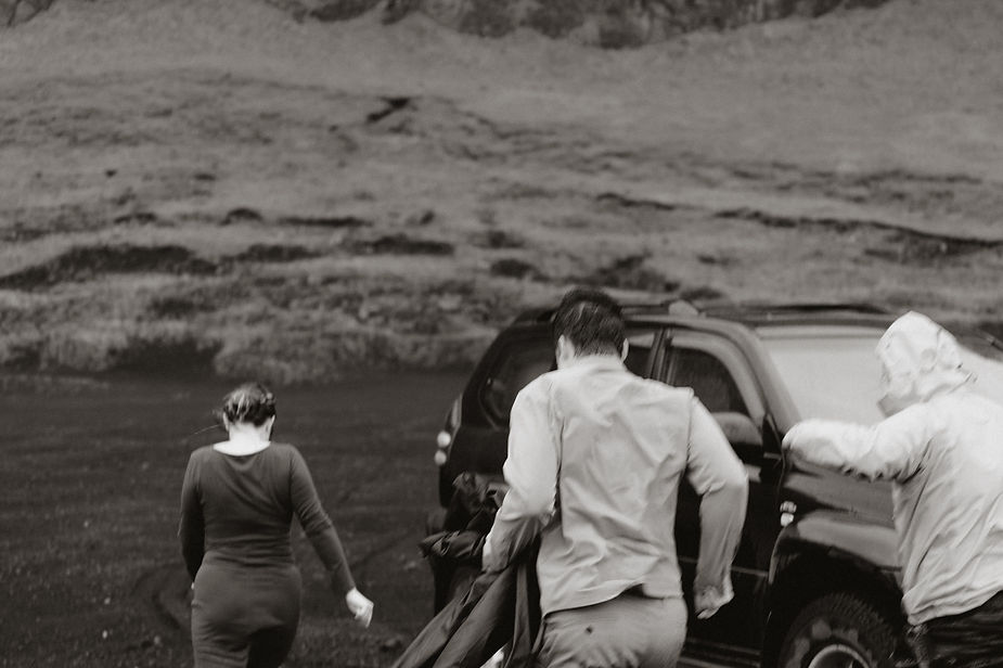 engaged couple gets out of car during engagement photos with iceland elopement photographer.