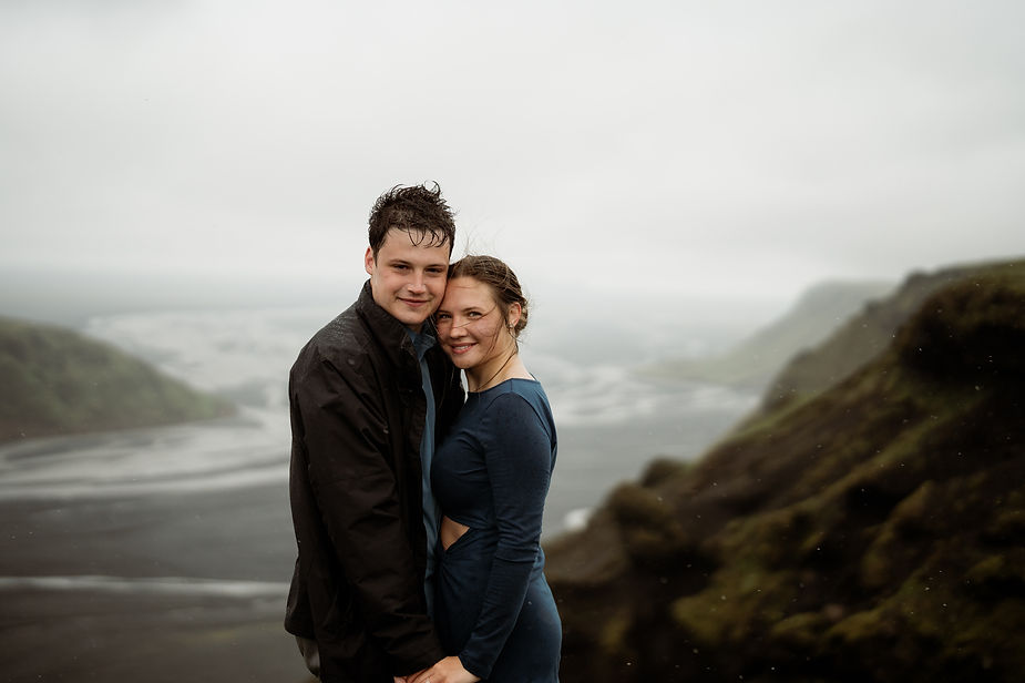 engaged couple poses for iceland elopement photographer during surprise proposal.