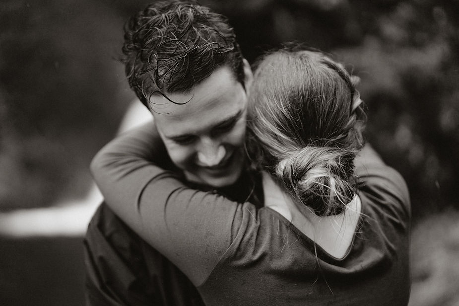 engaged couple hugs during engagement pictures with iceland elopement photographer.