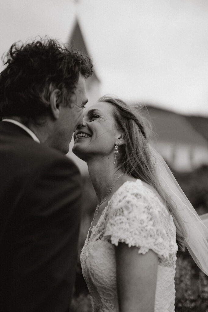 black and white image bride and groom kiss during iceland wedding photos.