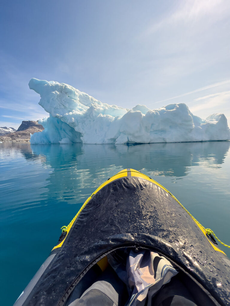 iceland elopement photographer kayaks during greenland elopement.