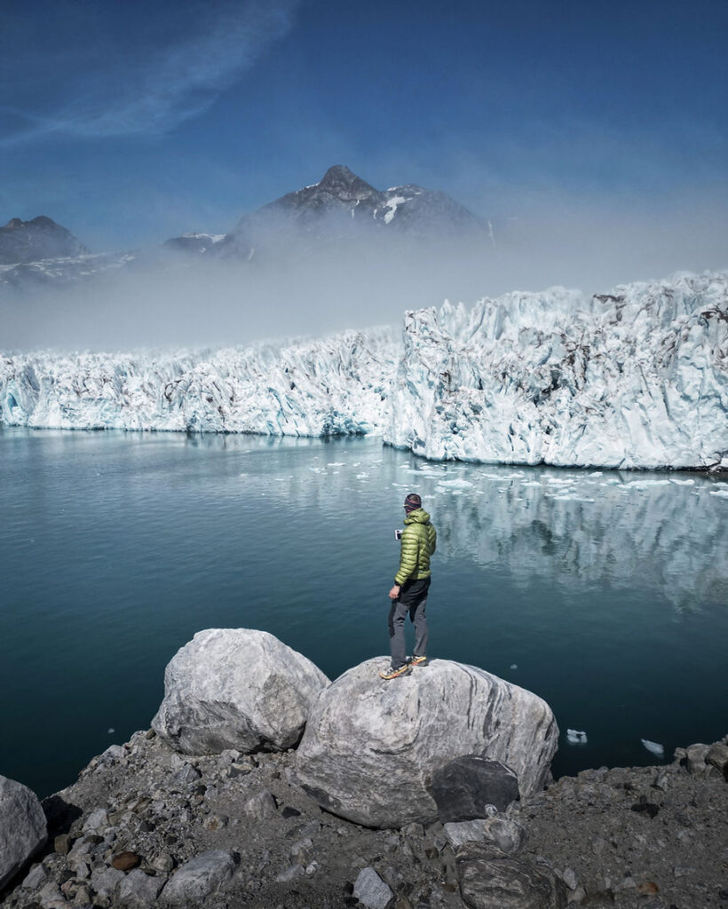 iceland elopement photographer drinks coffe while finding elopement locations in greenland.