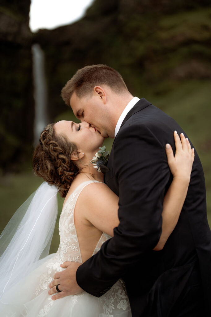 bride and groom kiss after iceland wedding ceremony.