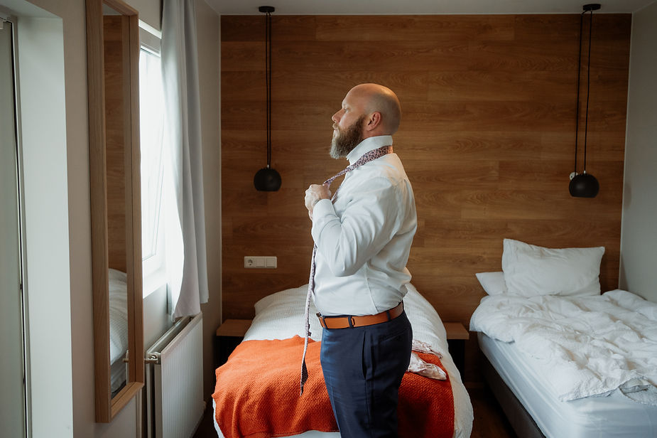 groom gets ready for his two day wedding adventure in iceland with elopement photographer.