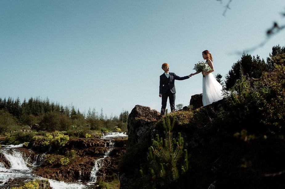 lgbtqi+ couple poses for iceland wedding photographer during their destination elopement.