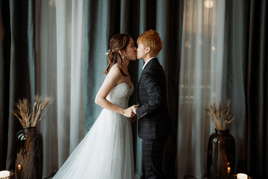 newly married couple kiss during destination wedding ceremony in iceland.