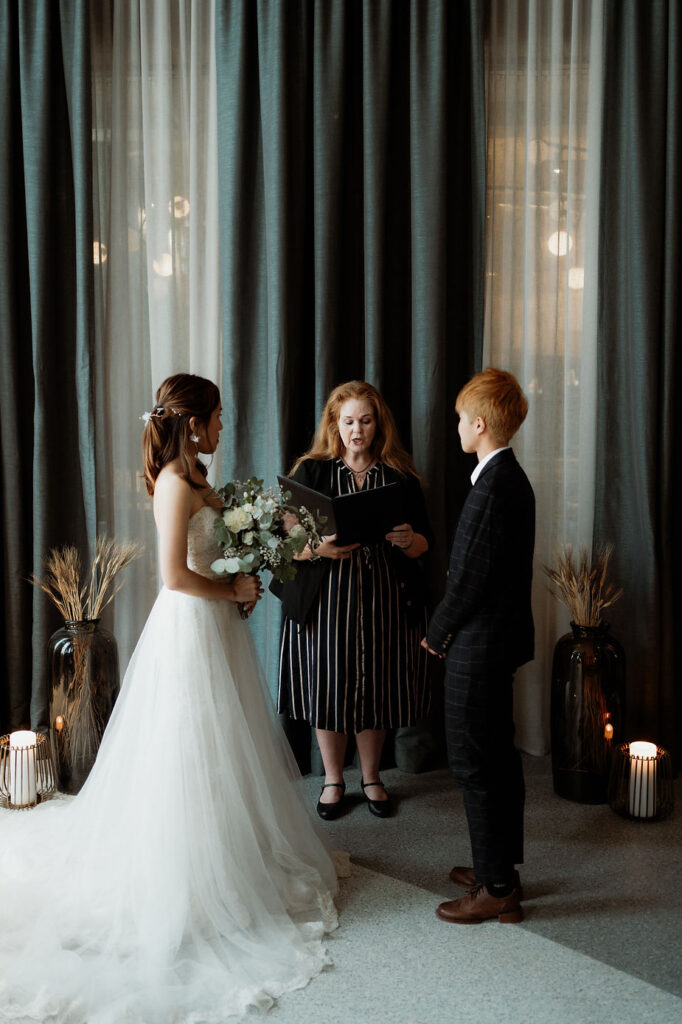 lgbtqi+ couple during their destination wedding ceremony in iceland.