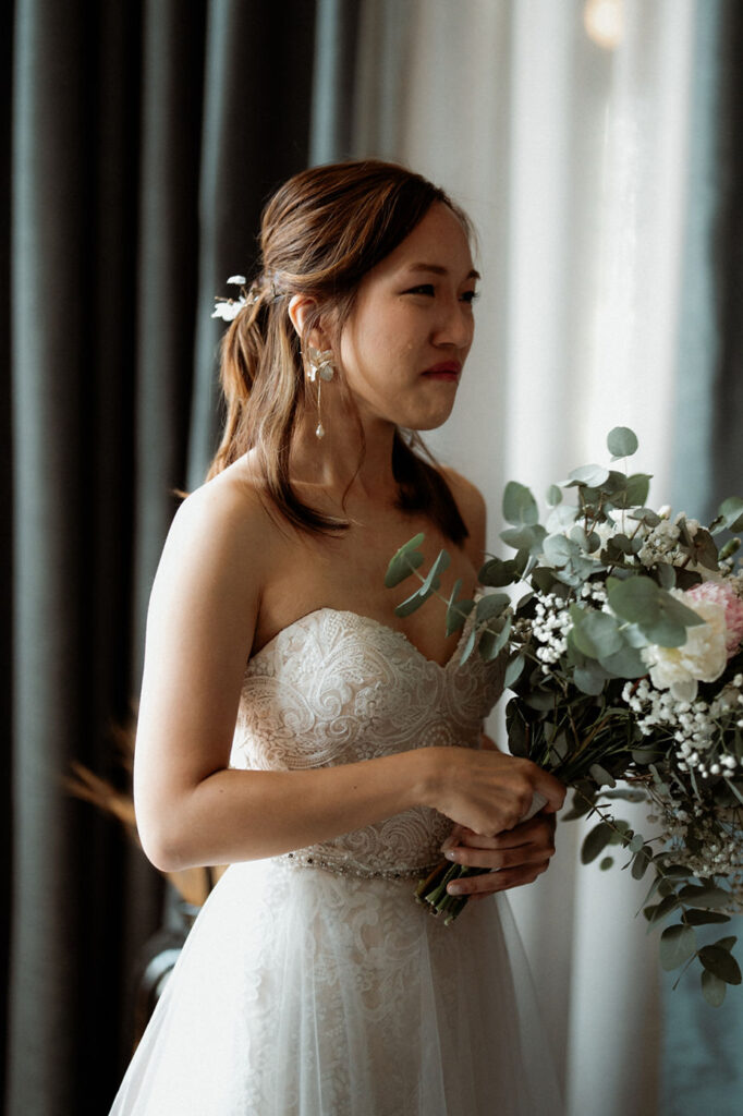 bride sheds a tear during destination wedding ceremony in iceland.
