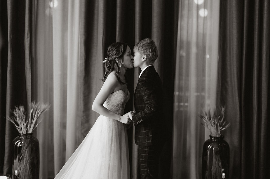 lgbtqi+ couple kisses during destination wedding ceremony in iceland.