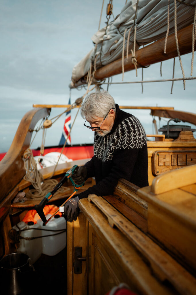 sailboat captain during a greenland adventure wedding.
