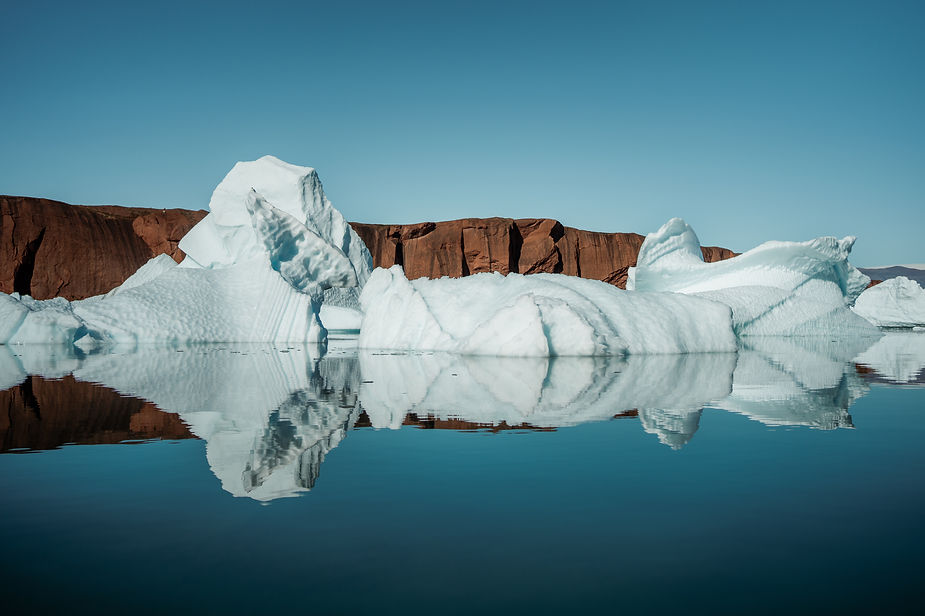glaciers on the coast of greenland during sailboat adventure.
