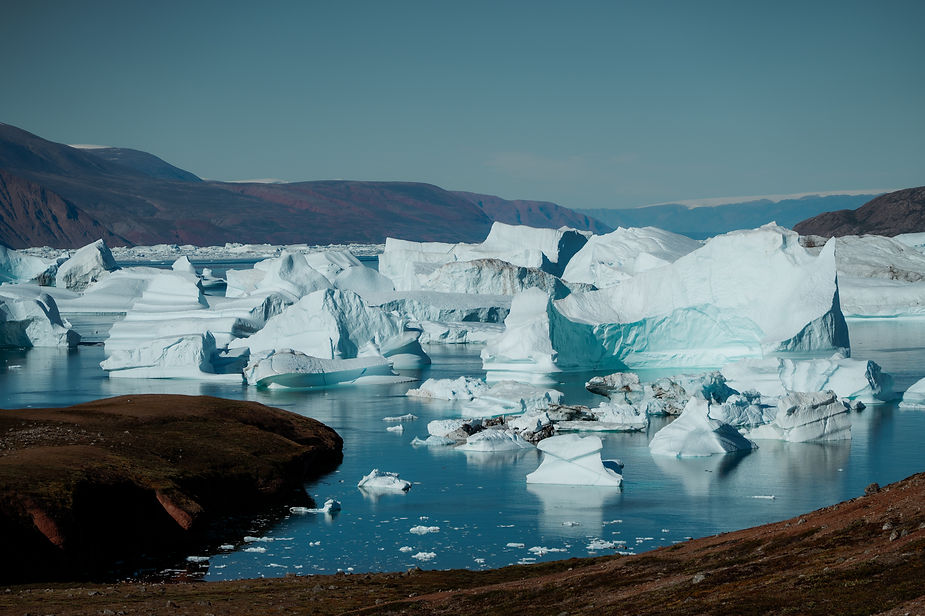 greenland coast filled with glaciers during sailboat adventure.