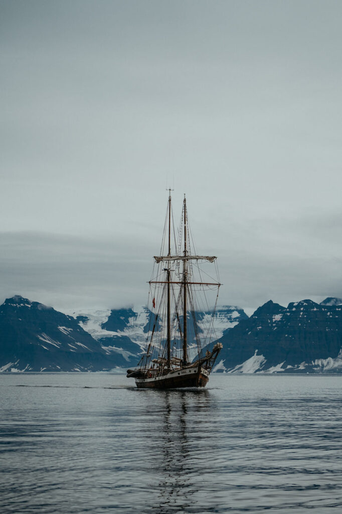 sailboat goes through greenland during a destination wedding.