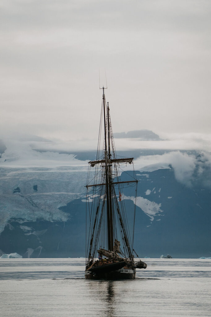 sailboat goes through greenland during a destination wedding.