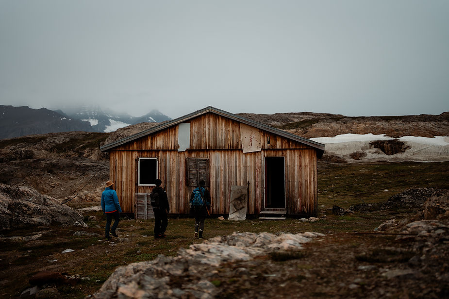 people walk into abandoned house during destination elopement.