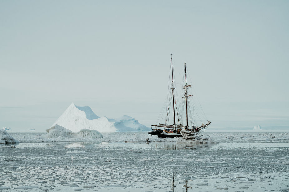 sailboat goes through greenland during adventure elopement wedding.