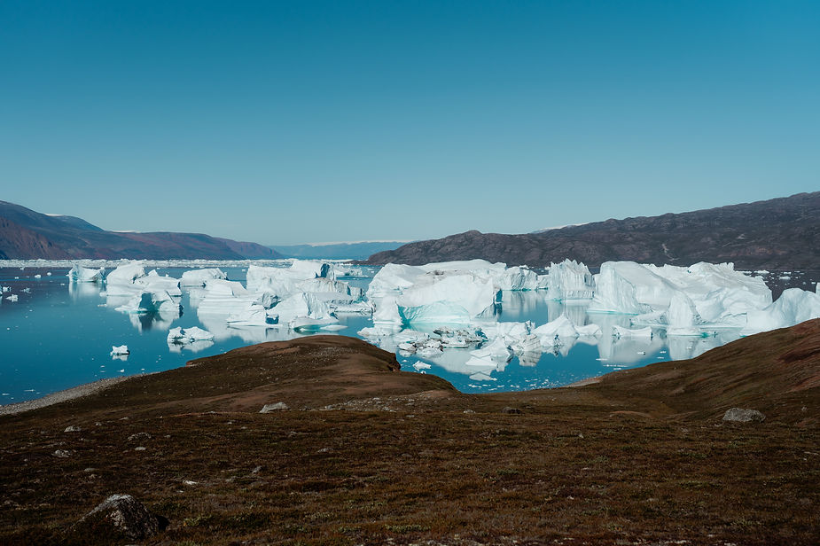 glaciers on the coast of greenland during a sailboat adventure elopement.