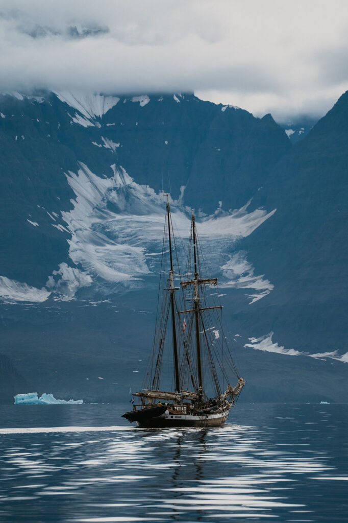 sailboat goes through greenland during a destination wedding.