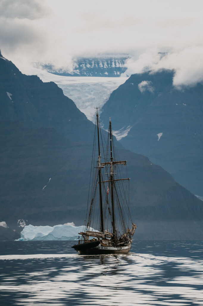 sailboat goes through greenland during a destination adventure elopement.