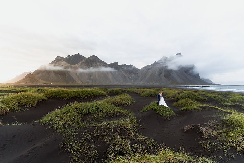 bride and groom stand on iceland landscape for their iceland wedding photos.