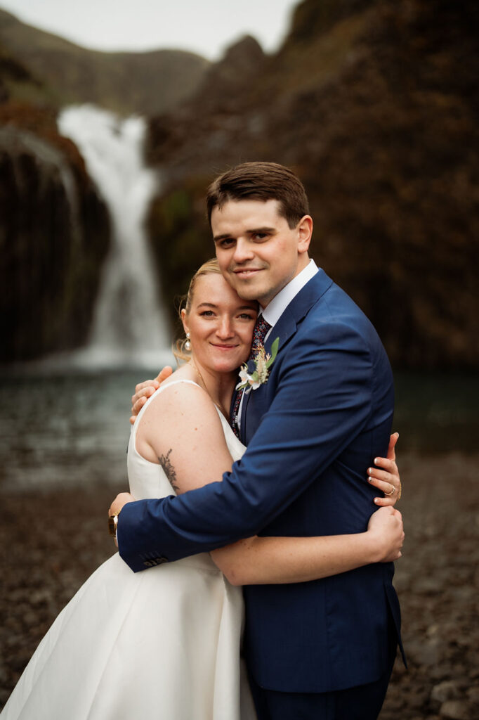 bride and groom hug during iceland wedding adventure.
