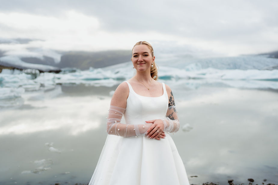 bride poses for iceland wedding photographer.