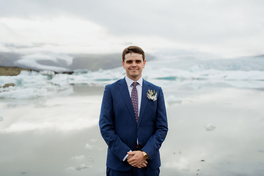 groom poses for iceland wedding photographer.