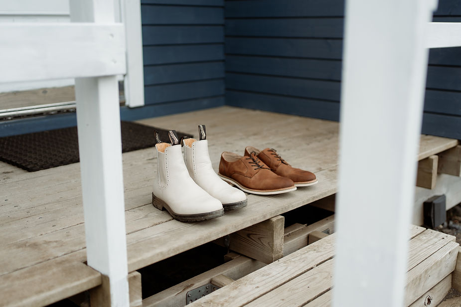 wedding shoes and boots sit outside for iceland wedding day.