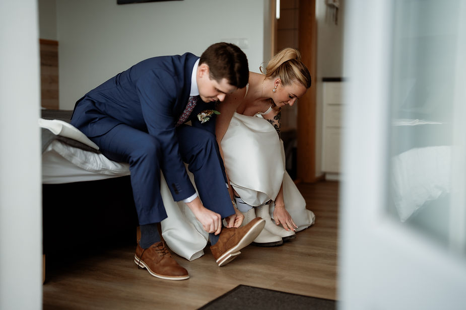 Bride and groom take getting ready photos for their iceland wedding day.