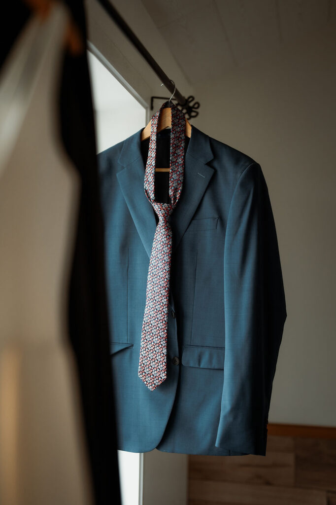 wedding suit hangs up during iceland wedding day.