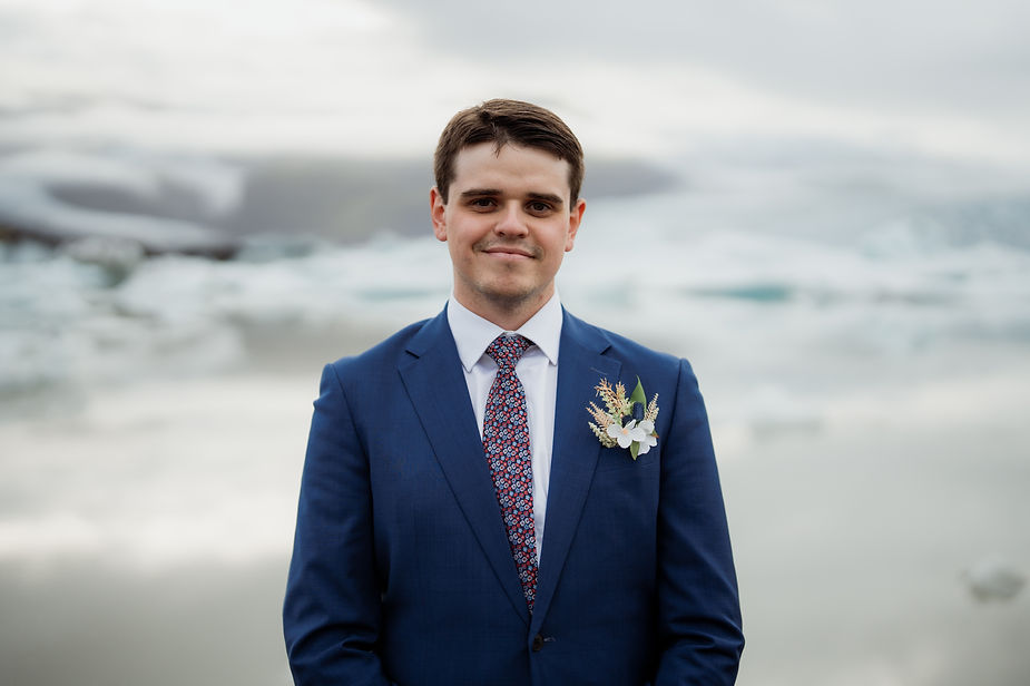 groom poses for iceland wedding photographer.