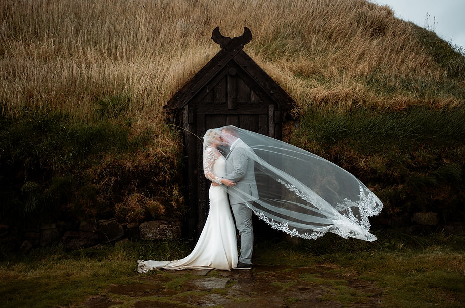 bride and groom kiss during their iceland elopement.