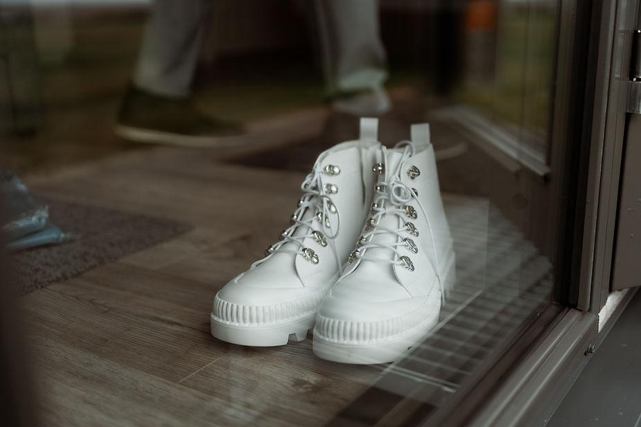white boots sit on the floor for an iceland wedding day.