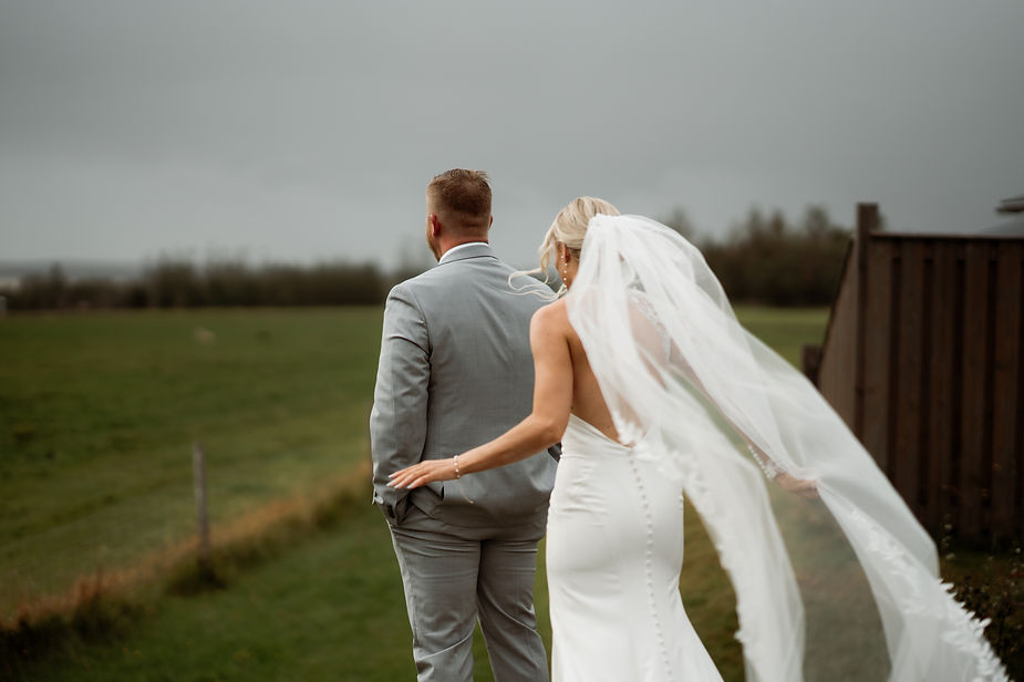 bride walks up to groom for wedding day first look.