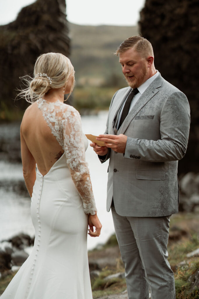 bride and groom say vows during their iceland elopement.