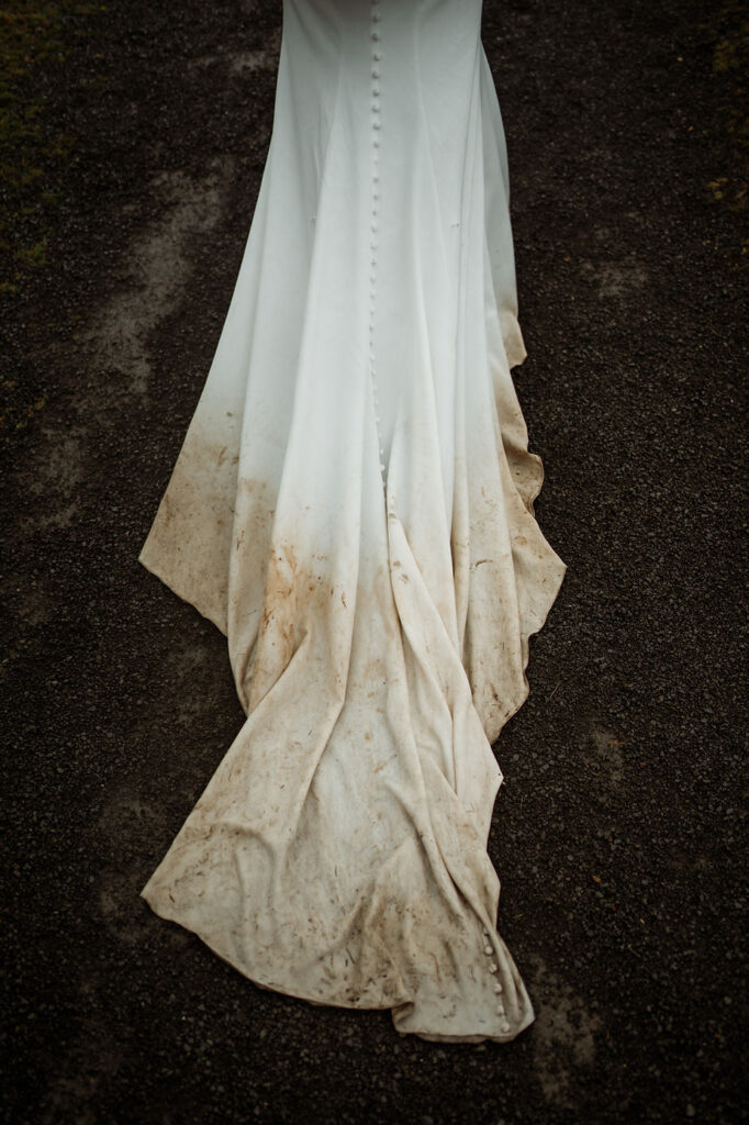 wedding dress gets dirty during iceland elopement adventure.