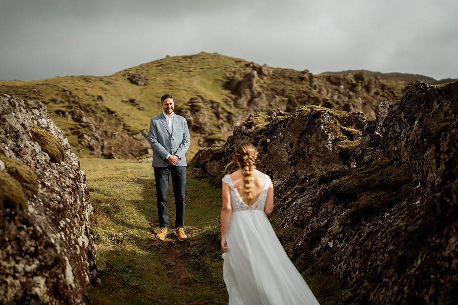 groom sees bride during elopement first look in iceland.