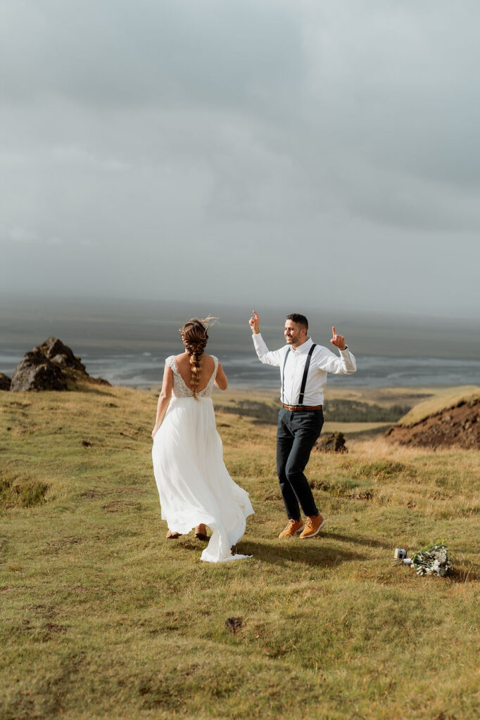 bride and groom dance during iceland wedding day.