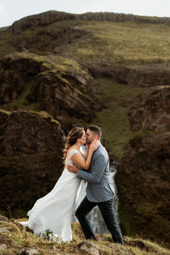 birde and groom kiss during iceland elopement.