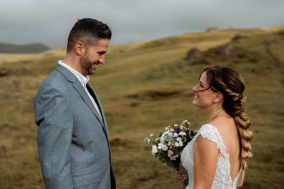 bride and groom smile at each other during adventure iceland elopement.