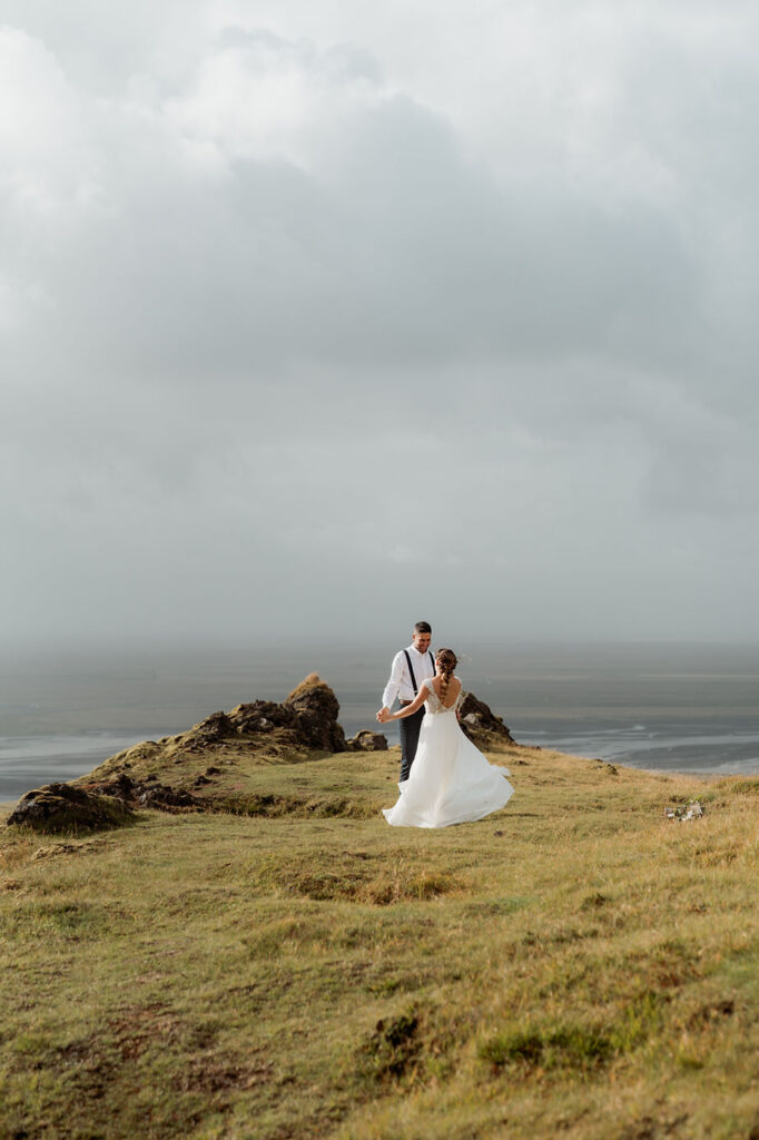 bride and groom dance during iceland wedding day.