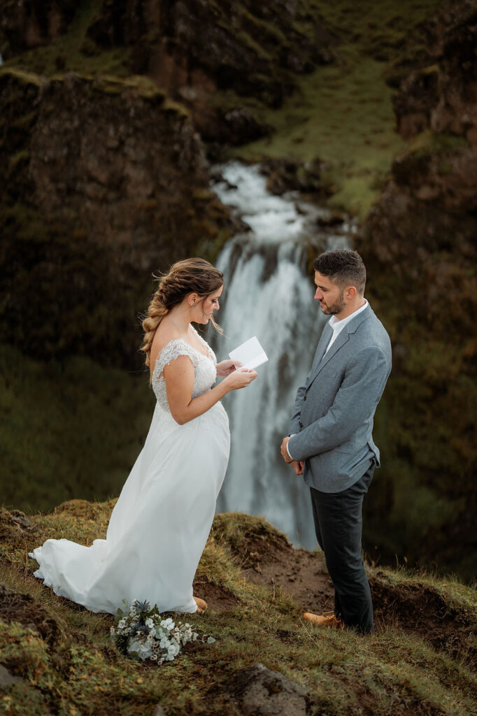 bride reads wedding vows to groom during adventure iceland elopement.